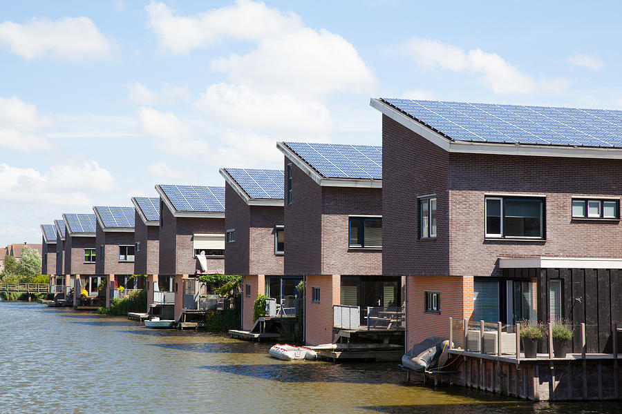 New family homes with solar panels on the roof Photograph by Ebobeldijk