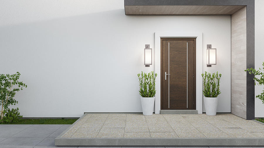 New house with wooden door and empty white wall. Photograph by Mirror Image Studio
