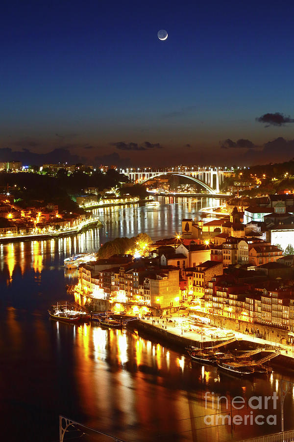 New moon over the River Douro and Ribeira Old Town Porto Portugal Photograph by James Brunker