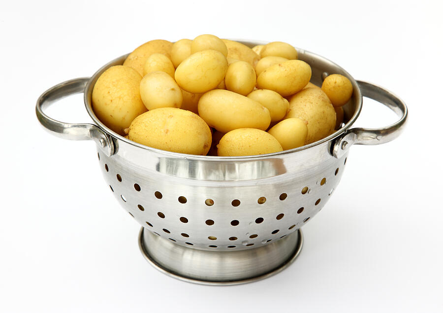 New potatoes in colander scrubbed ready to cook. Photograph by Rosemary Calvert