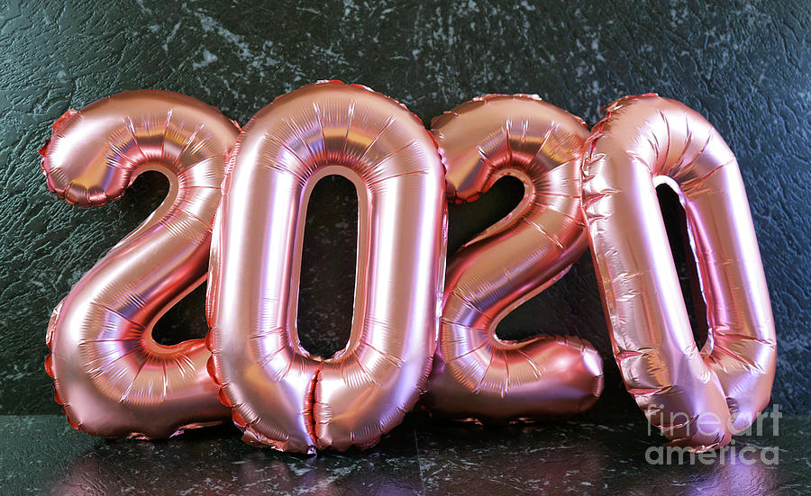 New Years Eve 2020 number metallic balloons on black marble background table. Photograph by Milleflore Images