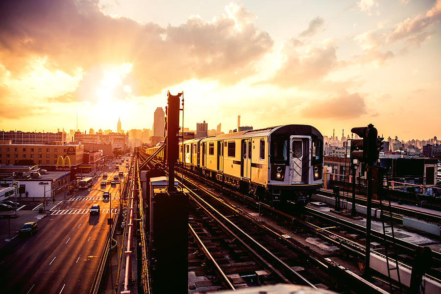 New York subway train approaching station platform in Queens Photograph by LeoPatrizi