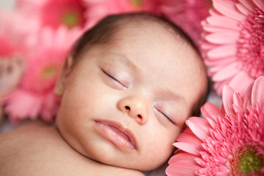 Newborn baby girl sleeping with daisies Photograph by Eurobanks