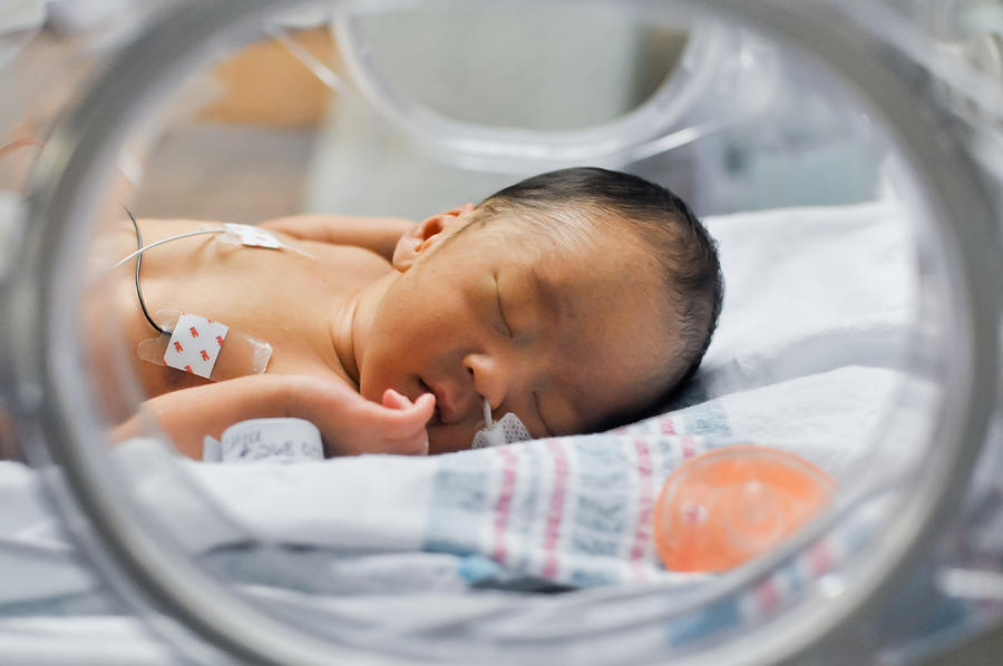 Newborn baby in incubator Photograph by Mkl