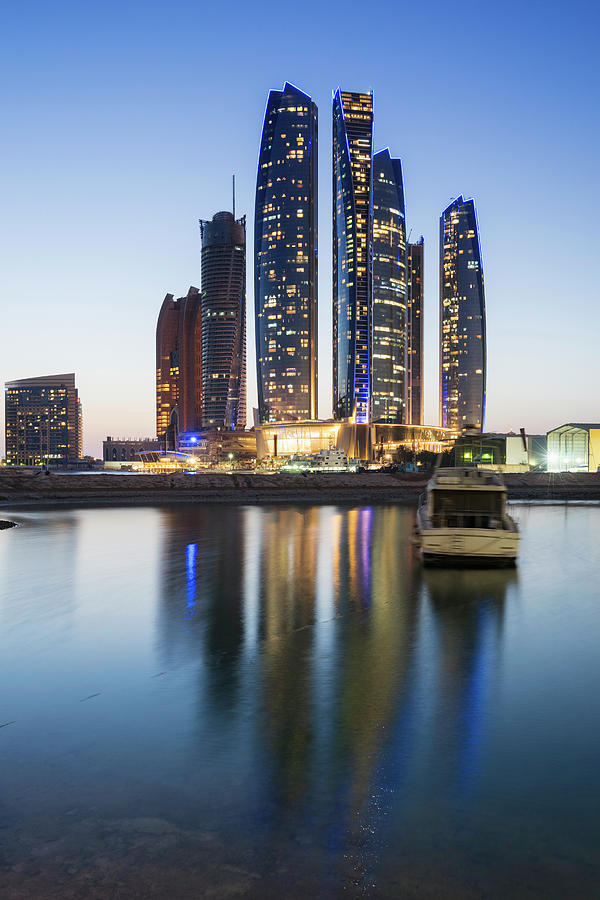 Night skyline view of Etihad Towers in Abu Dhabi Photograph by Iain ...