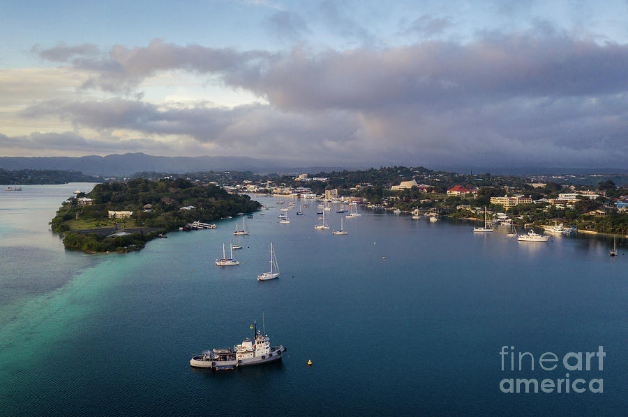 Nightfall over the Port Vila harbor with sailboat and other yach Photograph by Didier Marti