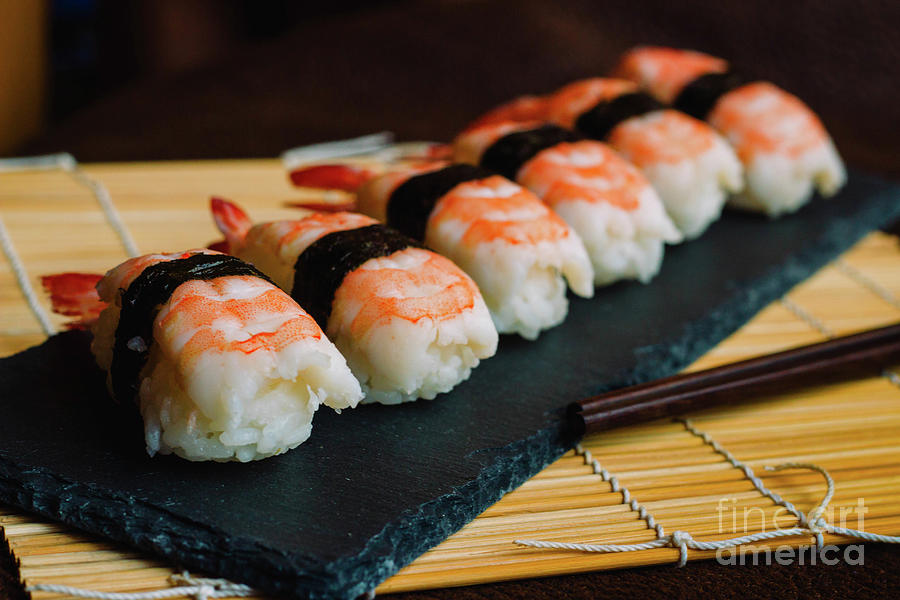 Nigiri sushi vertical image on a traditional bamboo rolling mat. Photograph  by Clara Murcia - Pixels