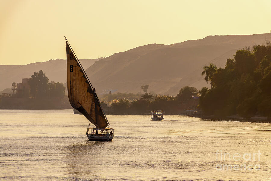 Nile river at sunset in Aswan, Egypt Photograph by Delphimages Photo Creations