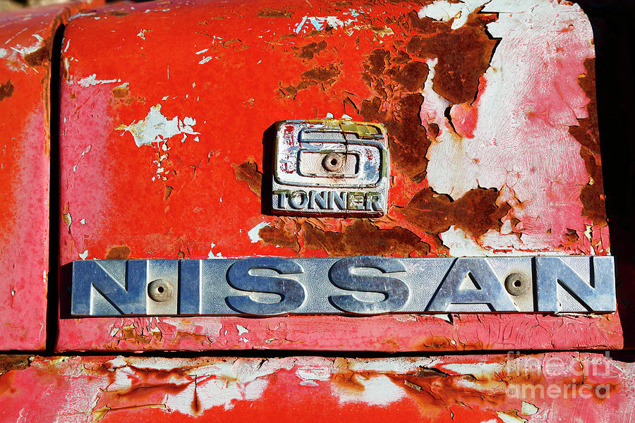 Nissan 6 Tonner badge Photograph by James Brunker