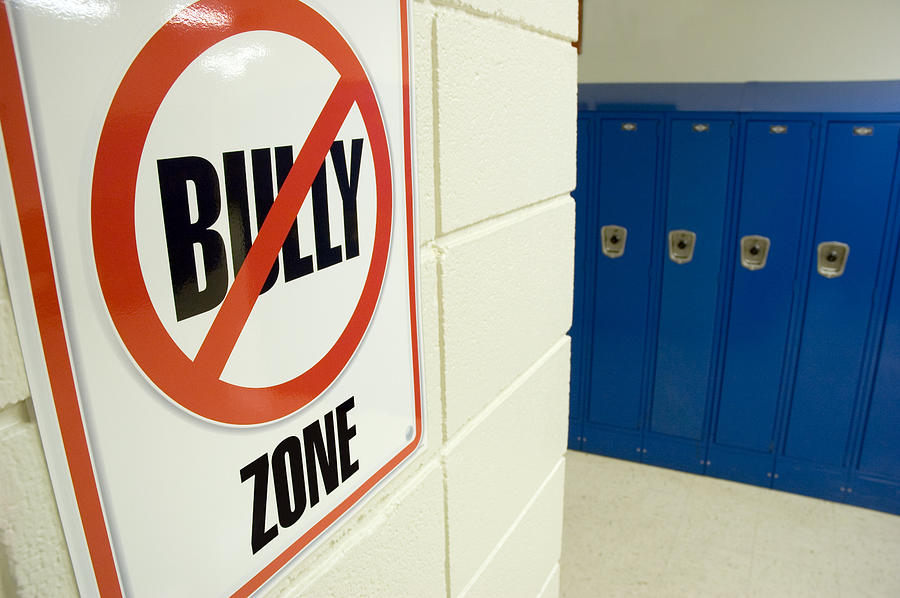 No Bullying Sign Located in School Hallway with Lockers Photograph by Plherrera