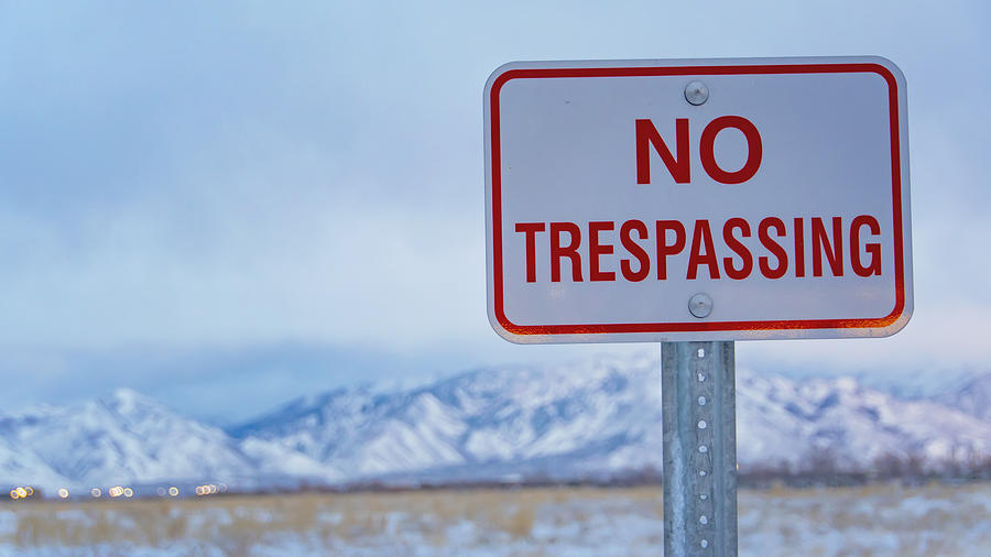 No Trespassing Sign Partially Photograph by Kryssia Campos