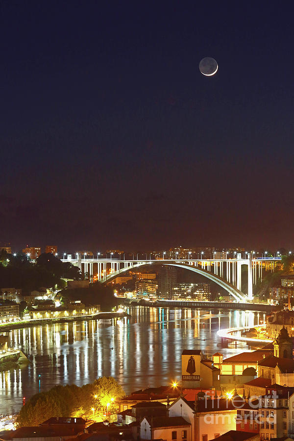 Bridge Photograph - New moon above the Ponte da Arrabida bridge Porto Portugal by James Brunker