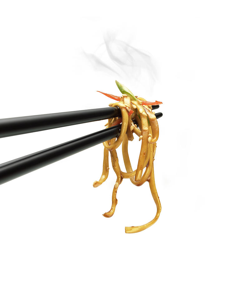 Noodles on a chopstick Photograph by Jeremy Hudson