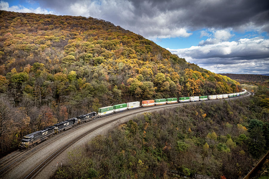 Norfolk Southern 4041, 1843, and 8016 lead an intermodal through Horseshoe Curve at Altoona Pennsyl Photograph by Jim Pearson