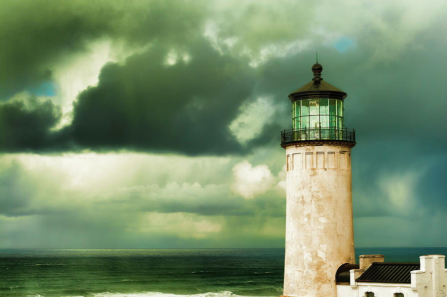 North Head Lighthouse under stormy skies Photograph by Dee Browning