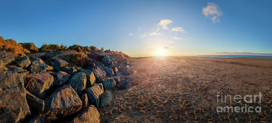 North Norfolk beach sunset and rocks Photograph by Simon Bratt