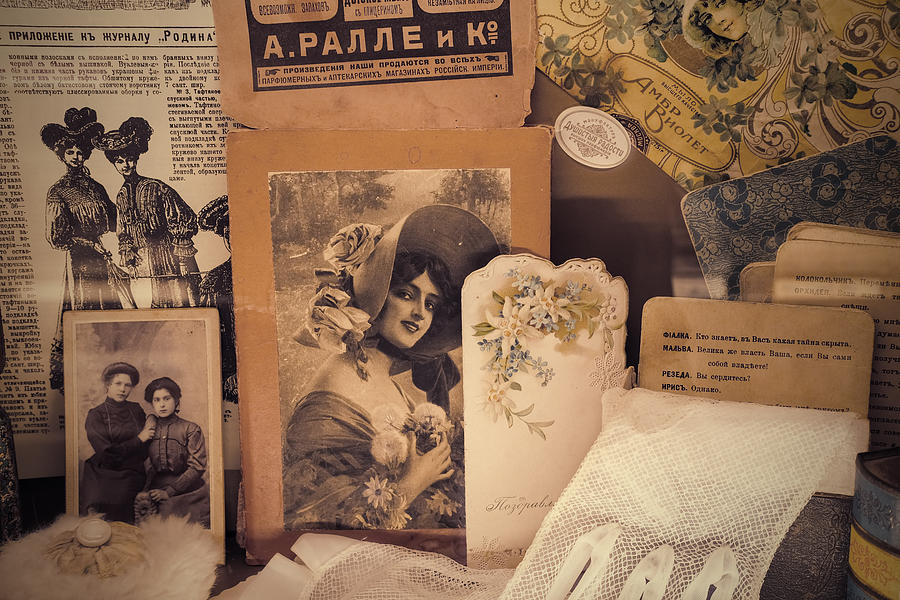 Nostalgic Vintage Background With Yellowed Sentimental Portraits Of Glamour Ladies, Old Post Card, Lace Glove, Feminine Accessories, Advertisement And Russian 1900-s Newspapers. Moscow, Russia, Jan 2021 Photograph