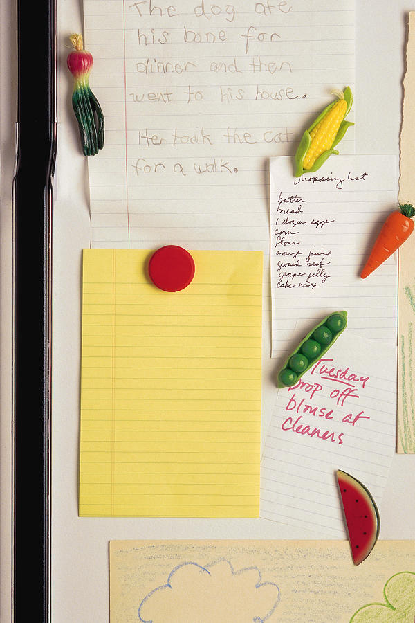Notepaper on refrigerator Photograph by Comstock