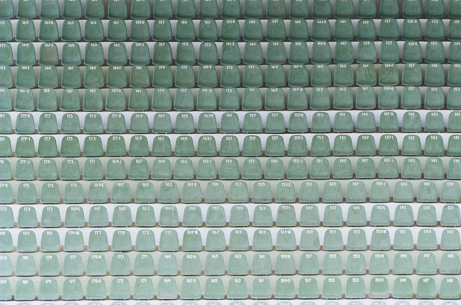 Numbered Seats in Stadium Photograph by Commercial Eye