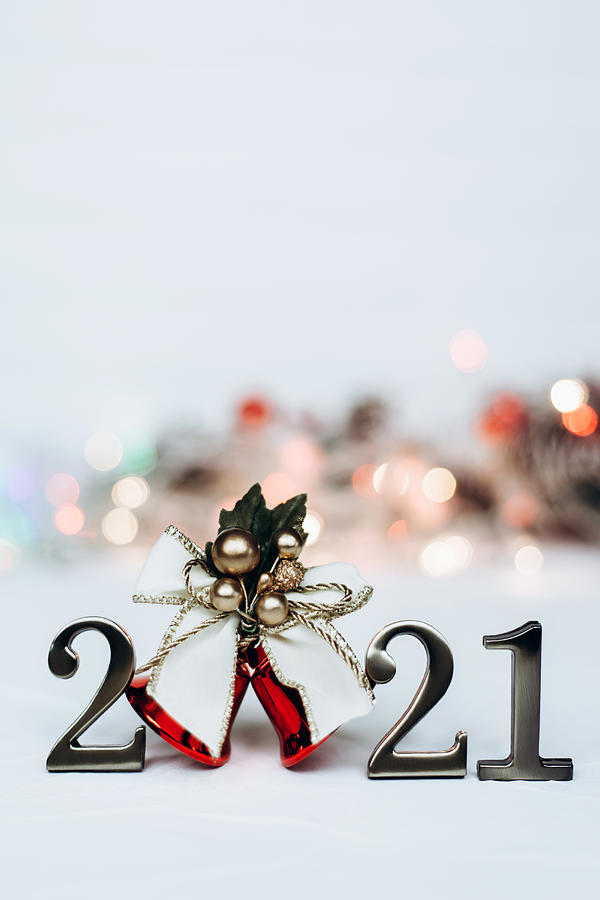 Numbers 2021 and bright christmas bell with gold ribbon Photograph by Olena Ruban