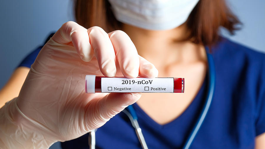 Nurse holding test tube with blood for 2019-nCoV analyzing. Novel Chinese Coronavirus blood test concept Photograph by Photoguns