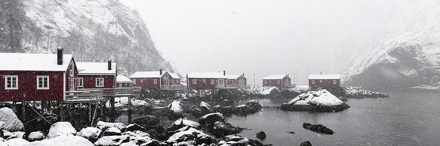Nusfjord Red cabins huts covered in snow Lofoten Islands in the  Photograph by Sonny Ryse
