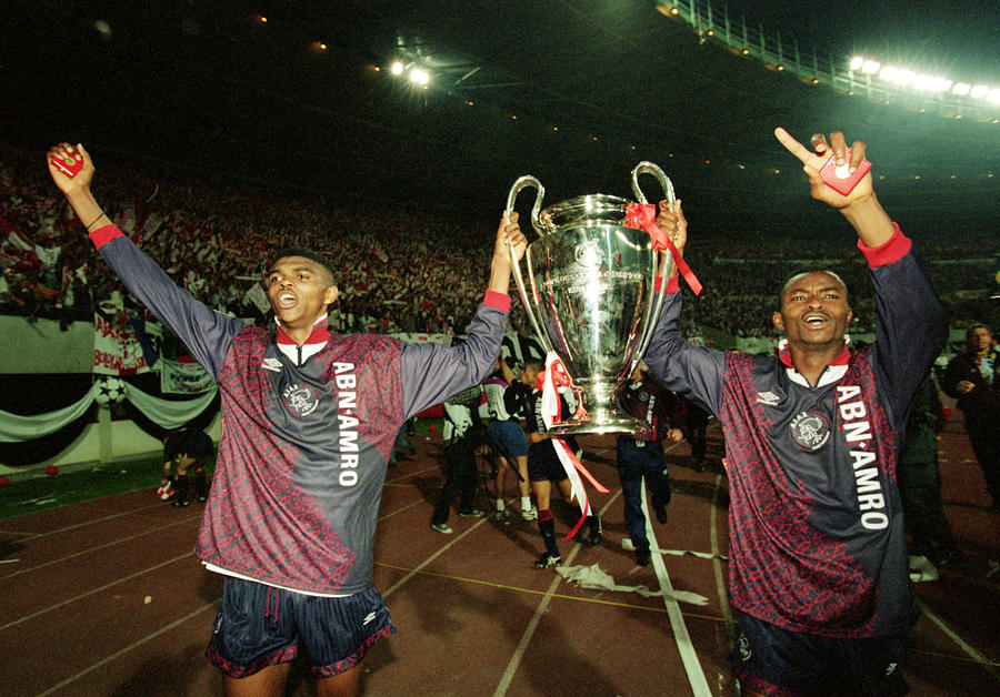 Nwankwo Kanu and Finidi George of Ajax lift the cup Photograph by Clive Brunskill