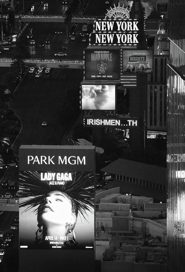 NYNY Marquee and Park MGM Billboard Featuring Lady Gaga Residency in Las Vegas Black and White Photograph by Shawn OBrien