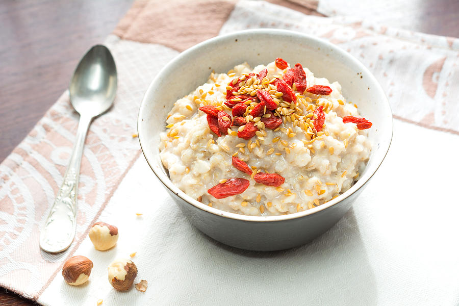 Oatmeal porridge with goji berries Photograph by Arx0nt