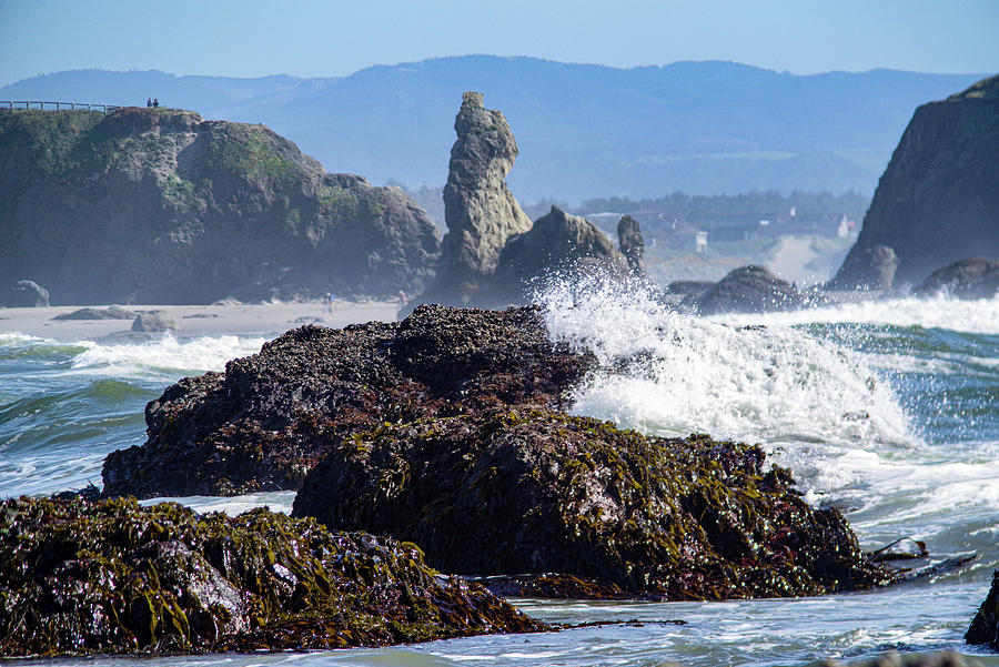 Ocean wave crashing against a rock Bandon Oregon Photograph by Jeff Swan