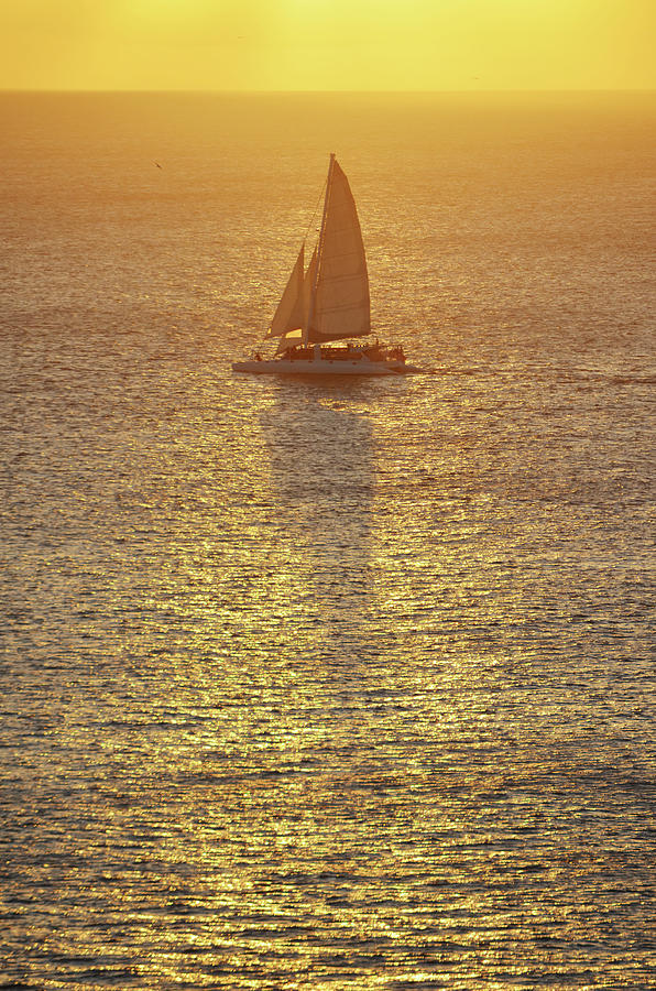 Of Sailboats Shadows and Sunsets Photograph by Shawn OBrien