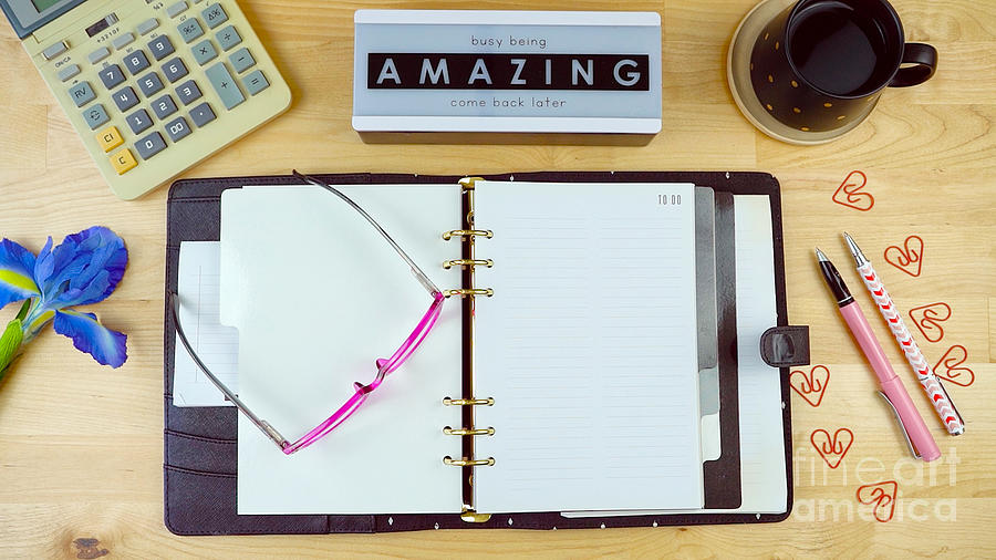 Office desk with diary planner, calculator, coffee and cute messag Photograph by Milleflore Images