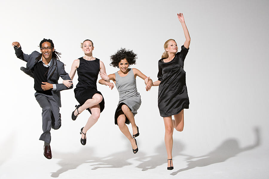 Office workers jumping Photograph by Image Source