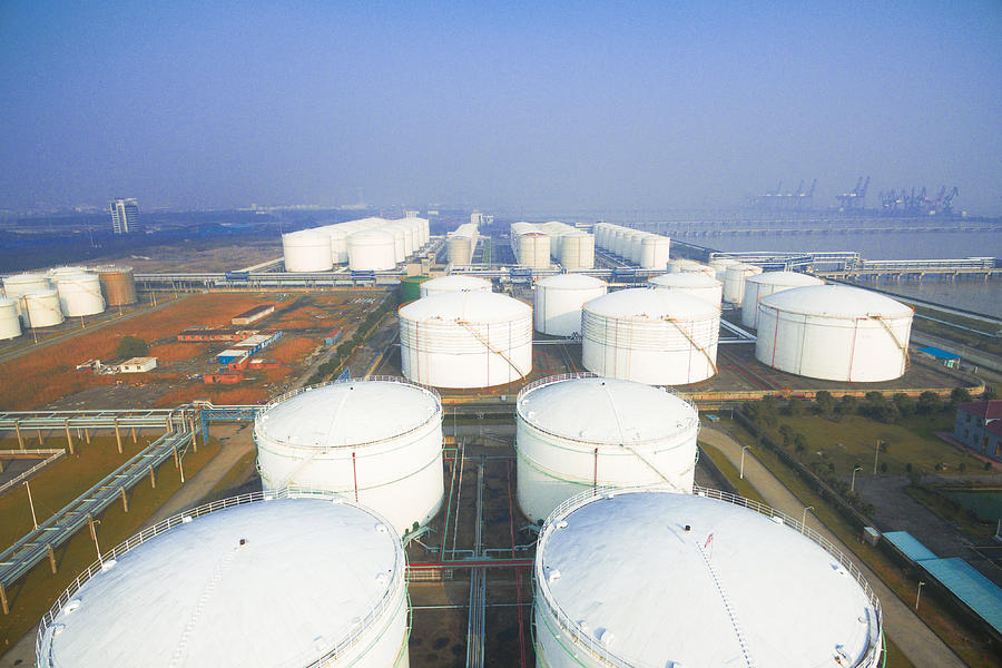 Oil Containers In Modern Refinery Plant In Blue Sky Photograph by Gong Hangxu