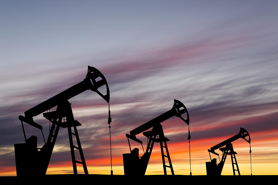 Oil pump on a sunset background. World Oil Industry Photograph by Anton Petrus