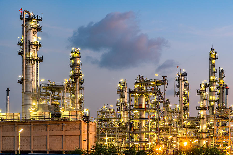 Oil refinery power station at sunset Photograph by Chanin Nont