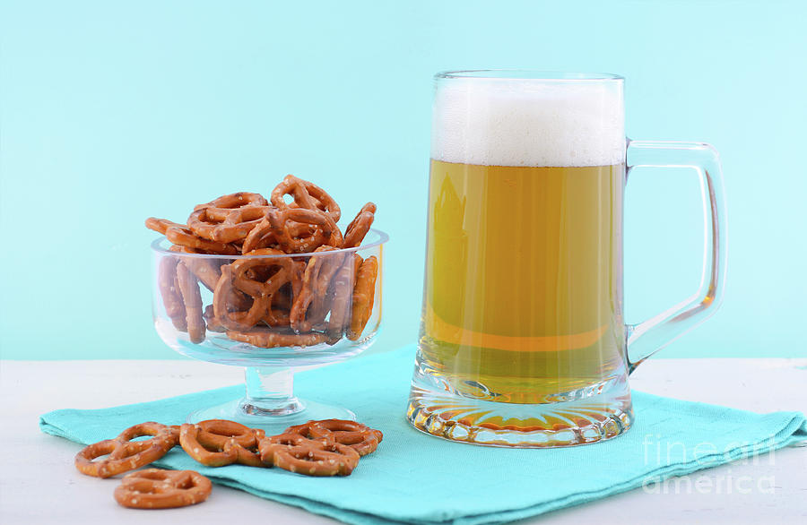 Oktoberfest beer and pretzels.  Photograph by Milleflore Images