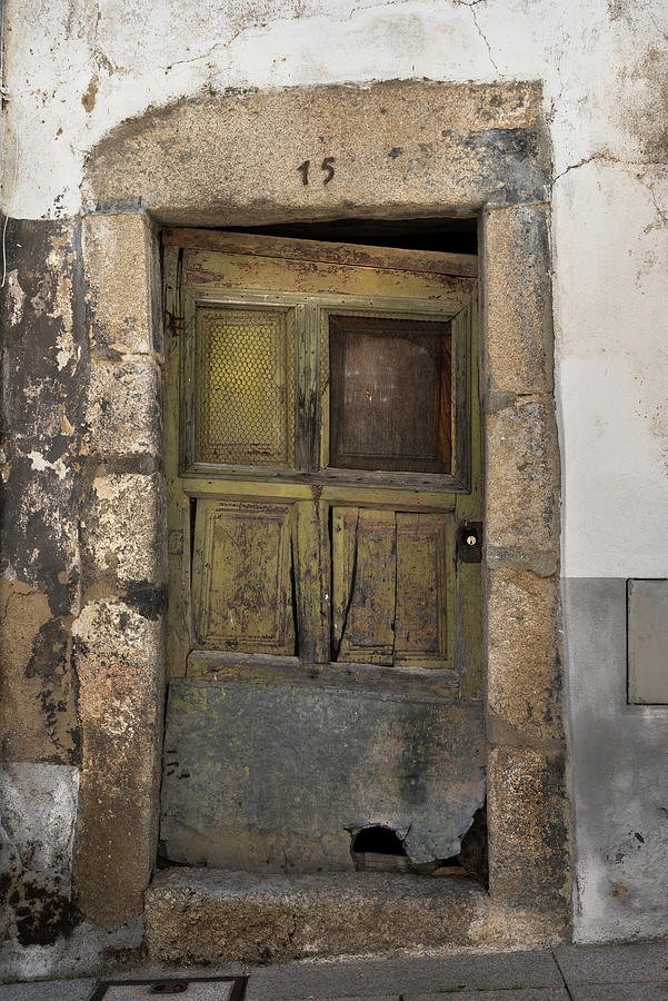Old and damaged green door in Picote Photograph by RicardMN Photography