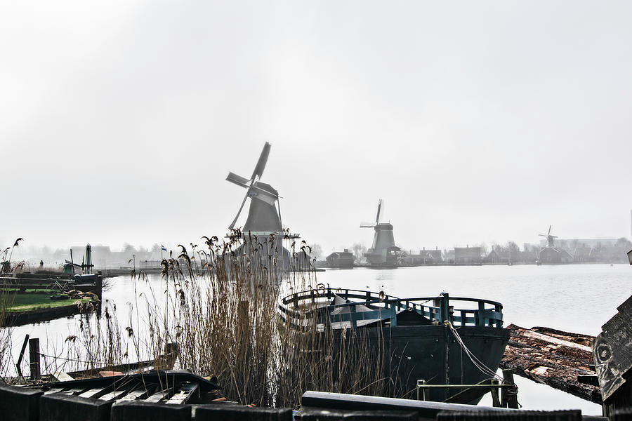Old boat and windmills Photograph by Pedro Cardona Llambias