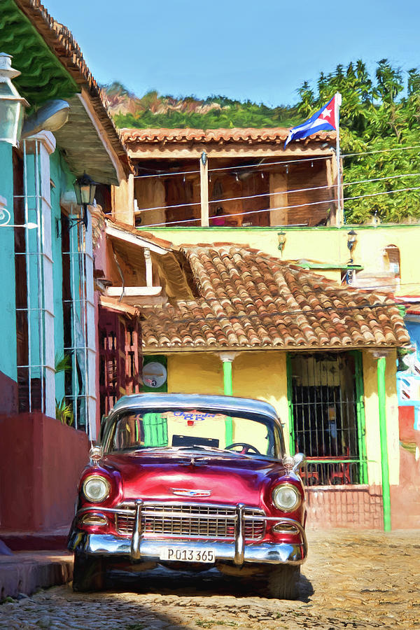 Transportation Photograph - Old Chevy in Cuba Town Square by Peggy Collins