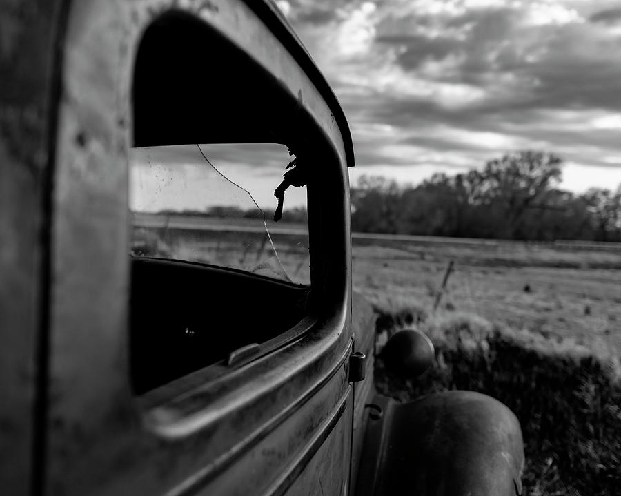 Old  Chevy truck looking over a field in black and white Photograph by Art Whitton