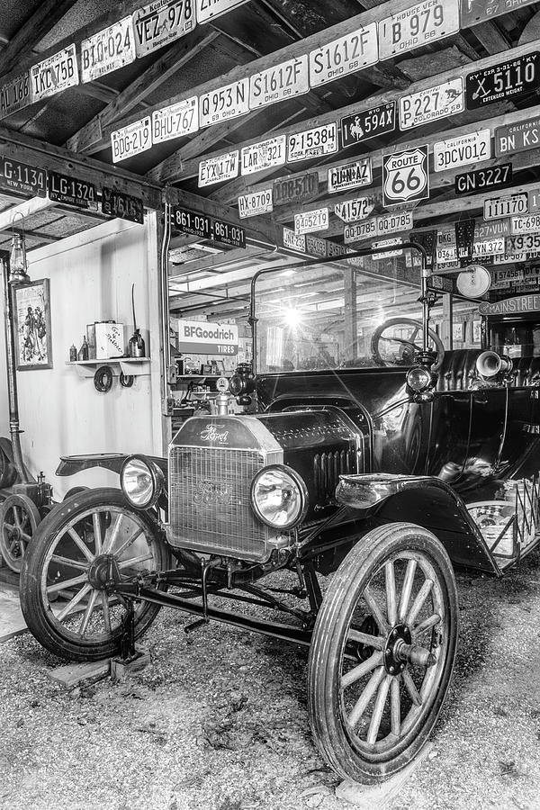 Old Classic in the Garage Black and White Photograph by Debra and Dave Vanderlaan