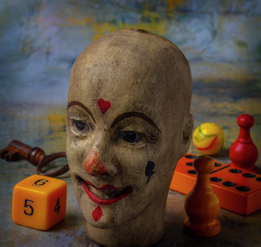 Old Clown Doll Head And Game Pieces Photograph by Garry Gay