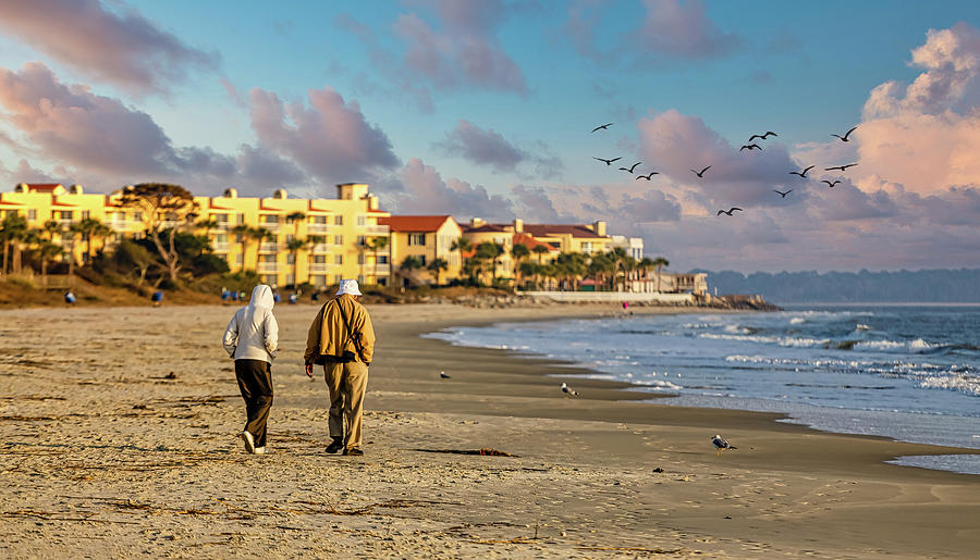 Old Couple Walking up Empty  Beach Photograph by Darryl Brooks