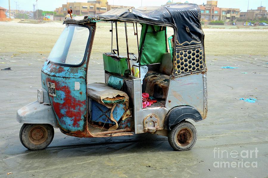 Old dilapidated Rickshaw tuk tuk on Sea View Beach Clifton Karachi Pakistan Photograph by Imran Ahmed