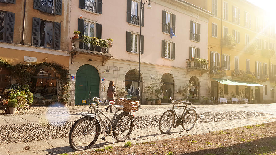 Old-fashioned bikes along Naviglio Grande, in Milan, Italy, in the morning Photograph by Busà Photography