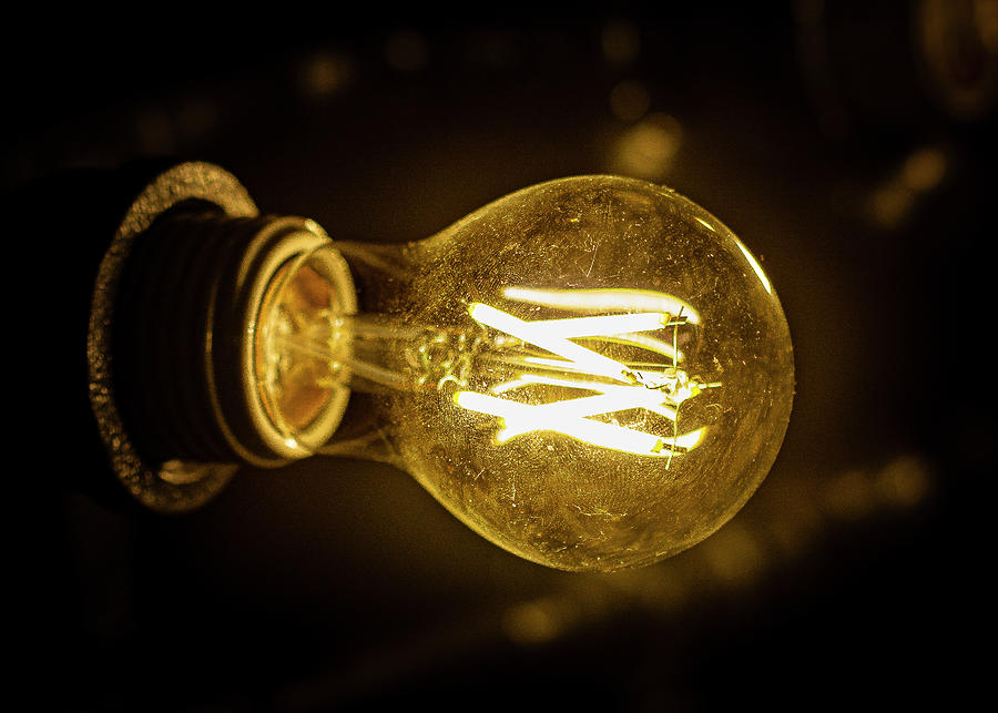 Old Fashioned Light Bulb Photograph by David Morehead