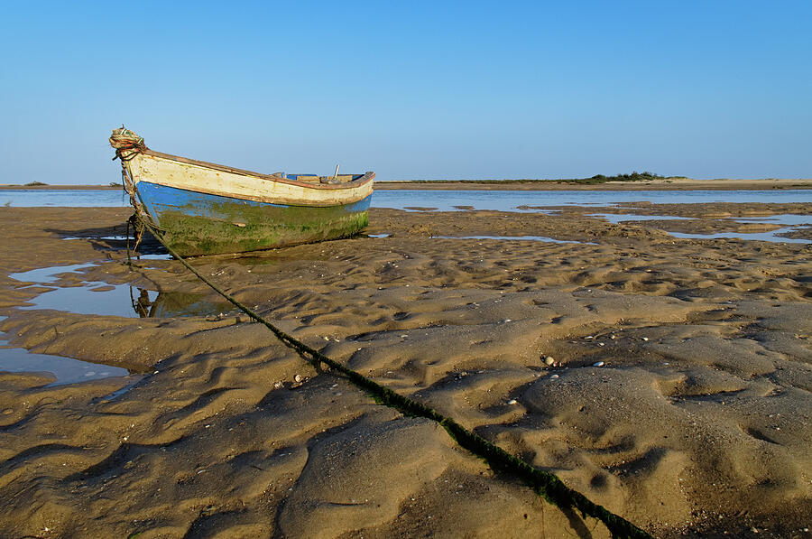 Old Fishing Boat and Low Tide Photograph by Angelo DeVal