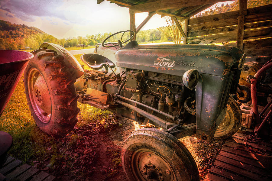 Old Ford Tractor in the Barn at Sunset Photograph by Debra and Dave Vanderlaan