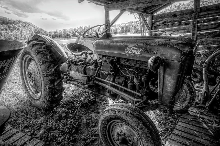 Old Ford Tractor in the Barn in Black and White Photograph by Debra and Dave Vanderlaan